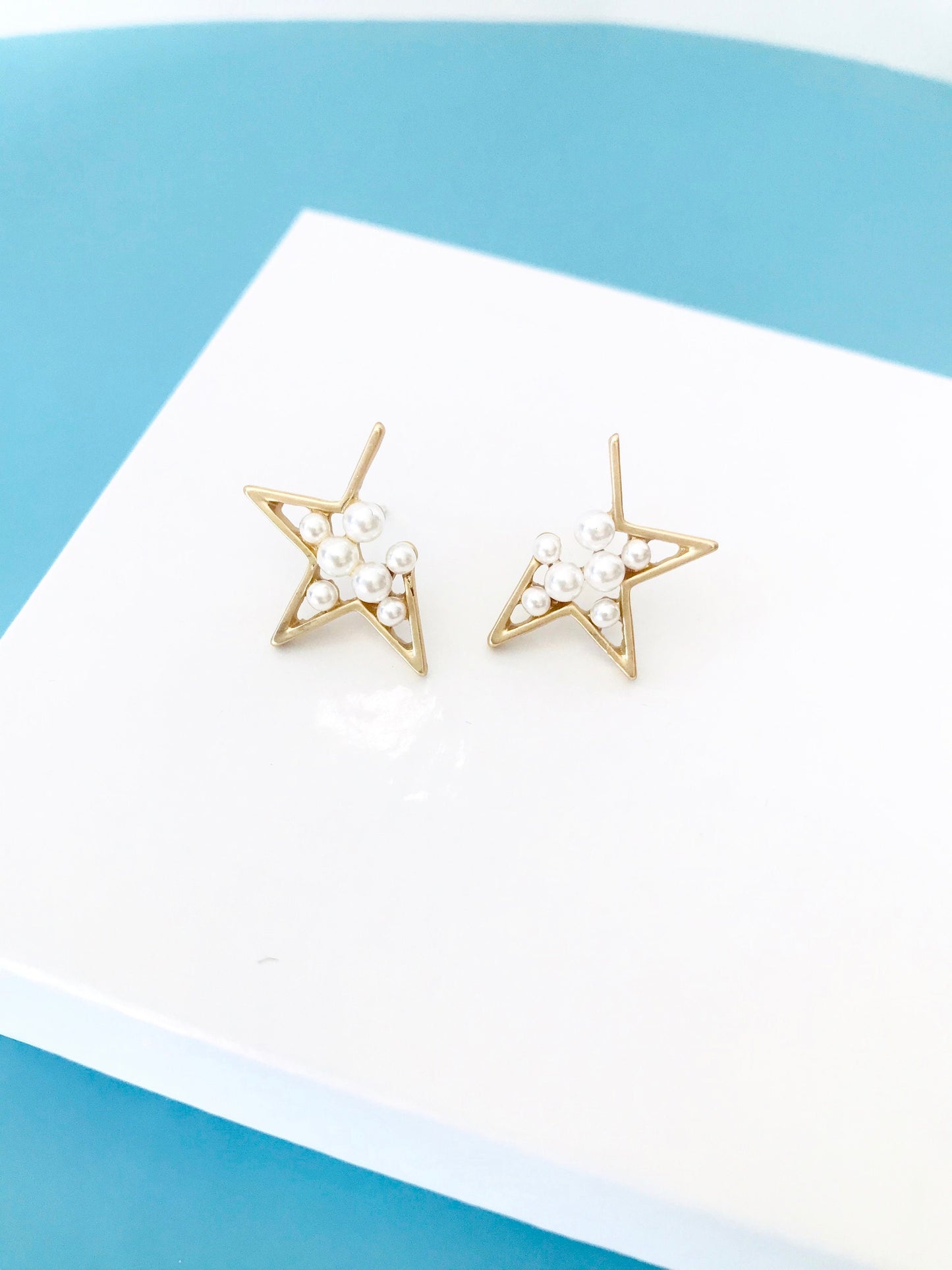 Pearl star earrings