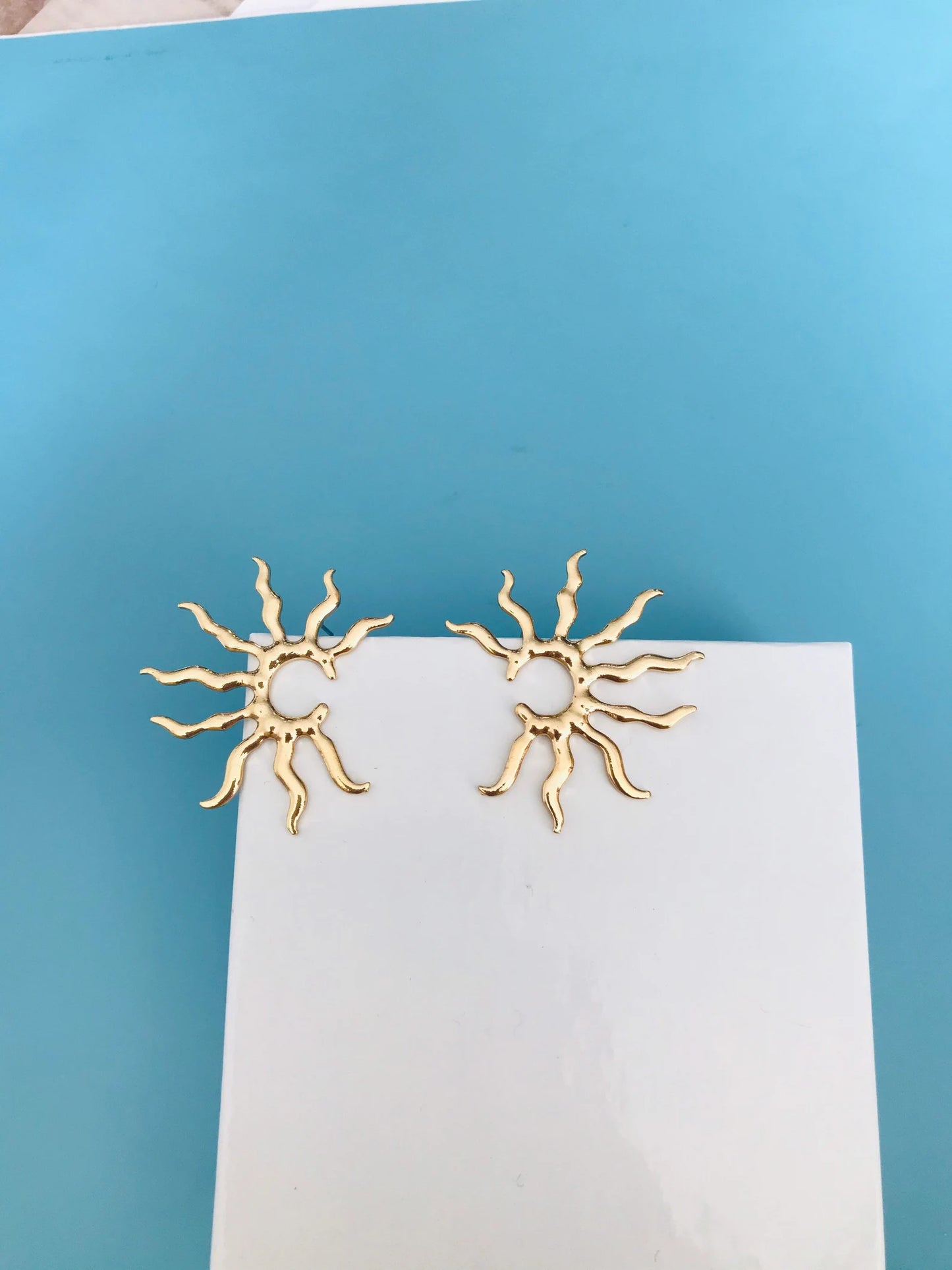 Gold star earrings