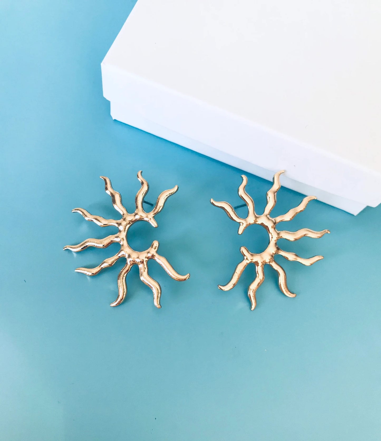 Gold star earrings