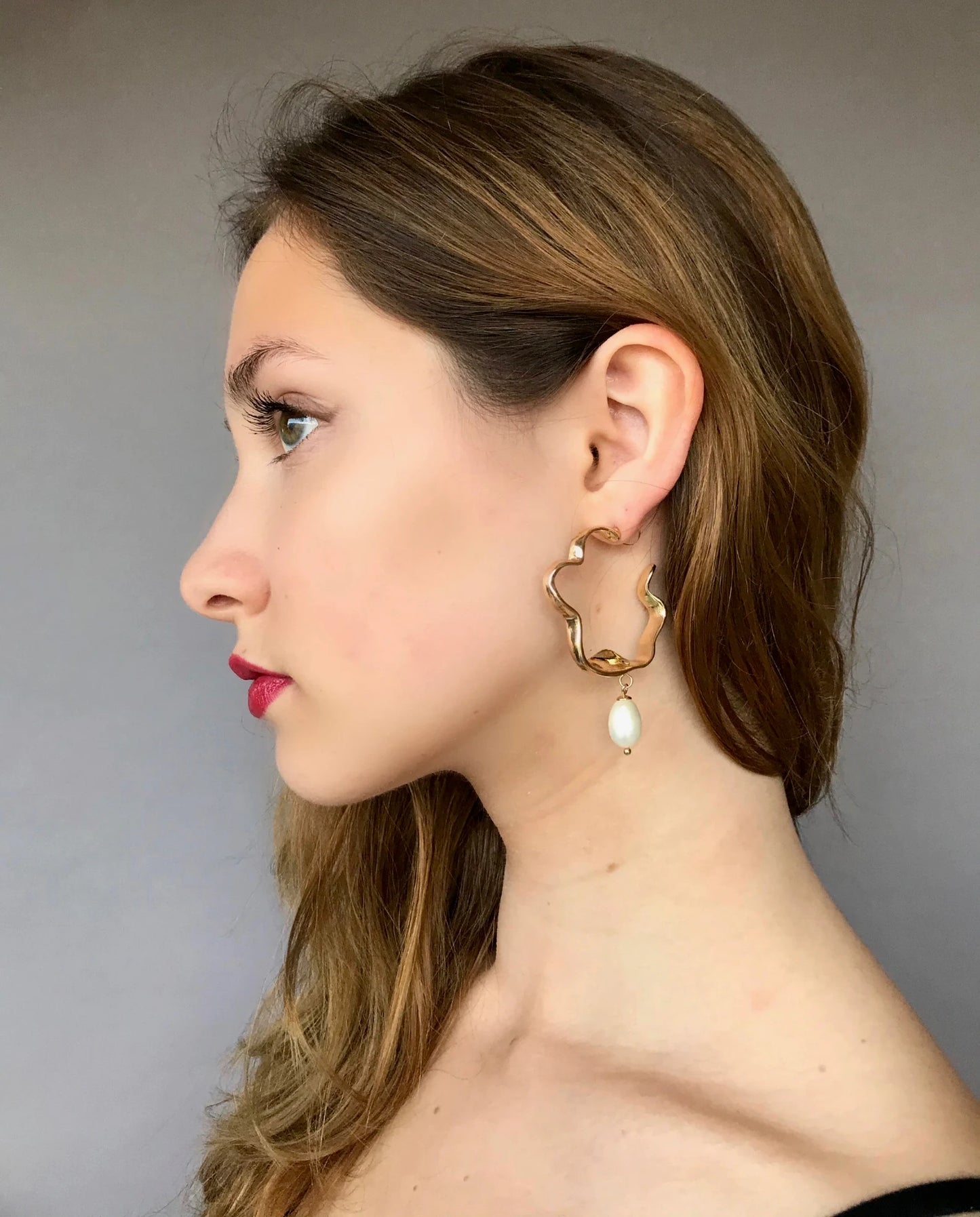 Large gold twisted hoop earrings