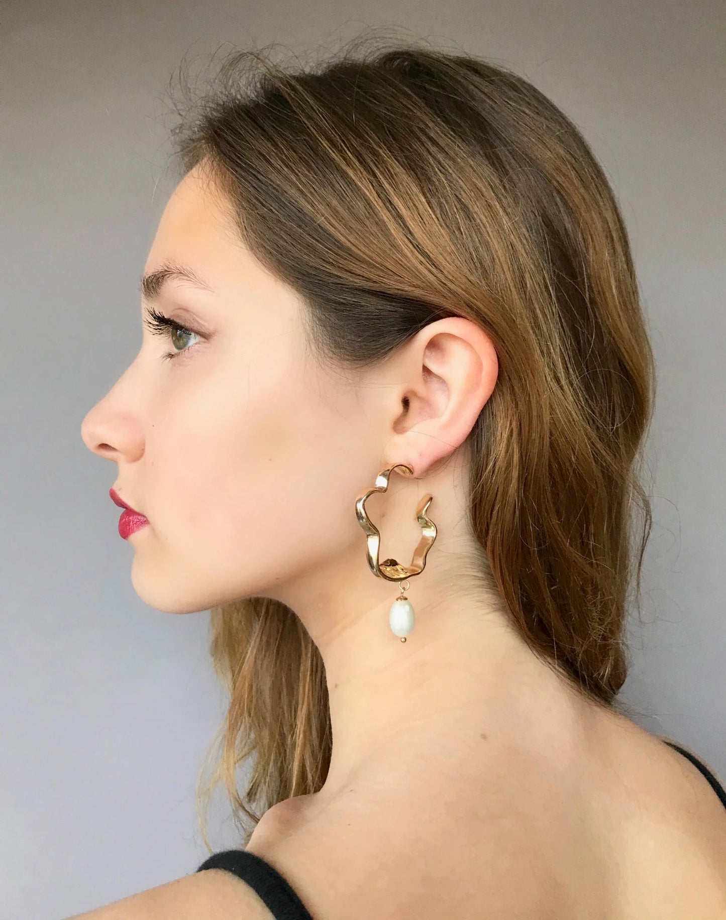 Large gold twisted hoop earrings