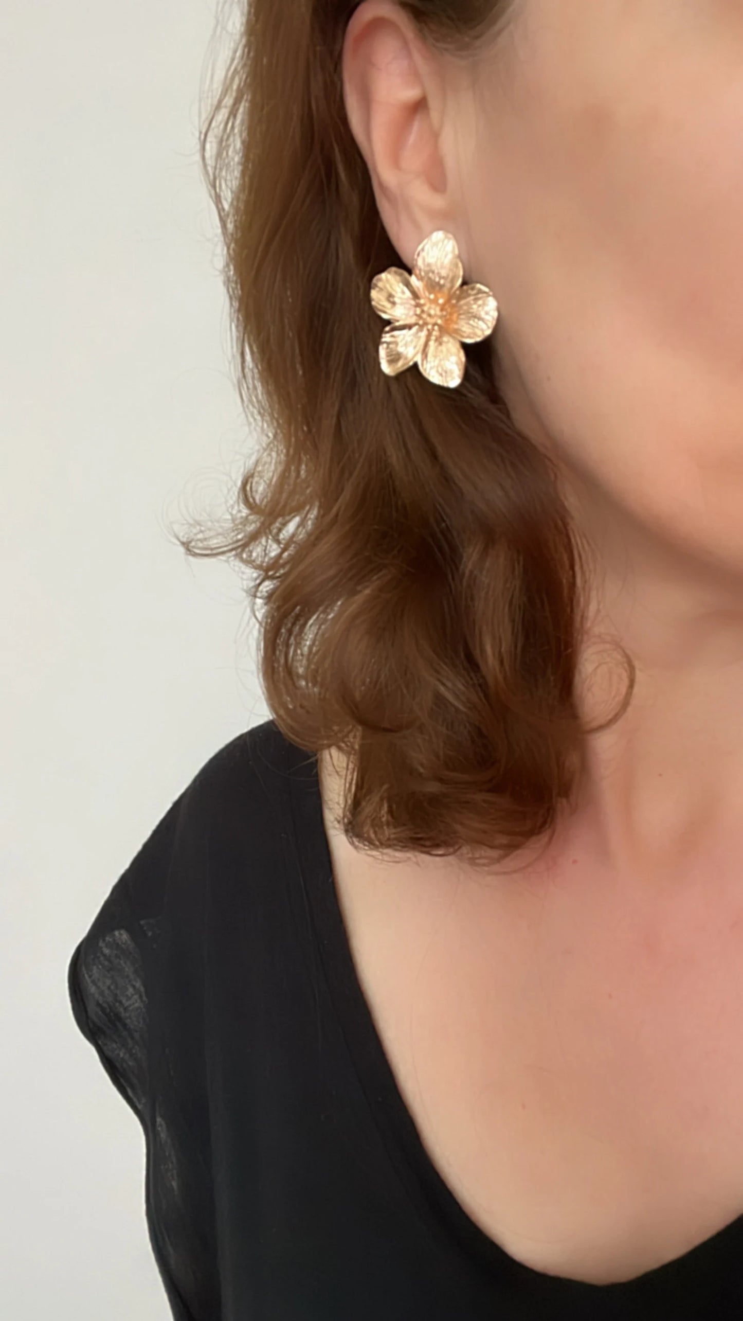 Gold flower stud earrings
