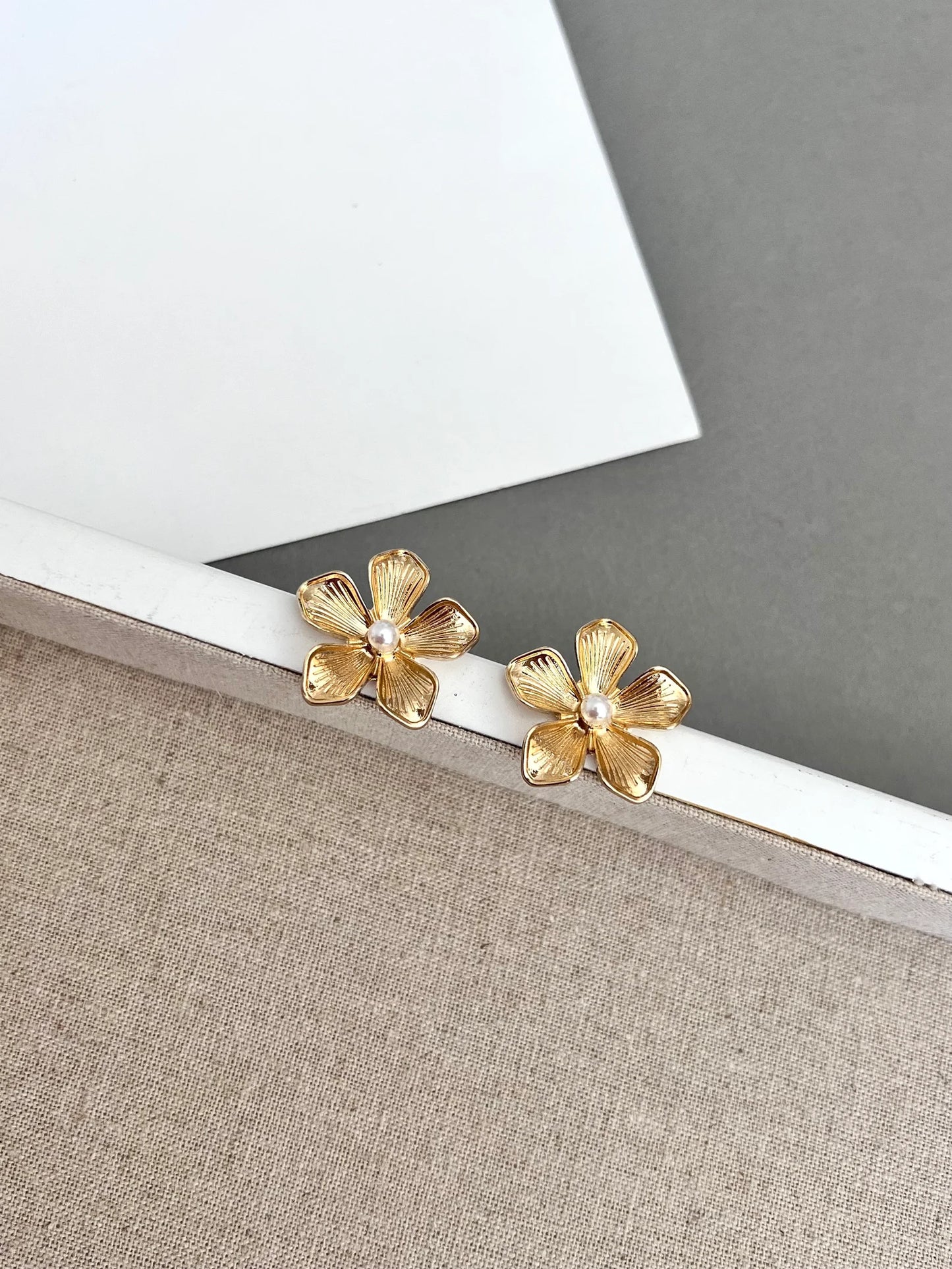 Gold flower stud earrings