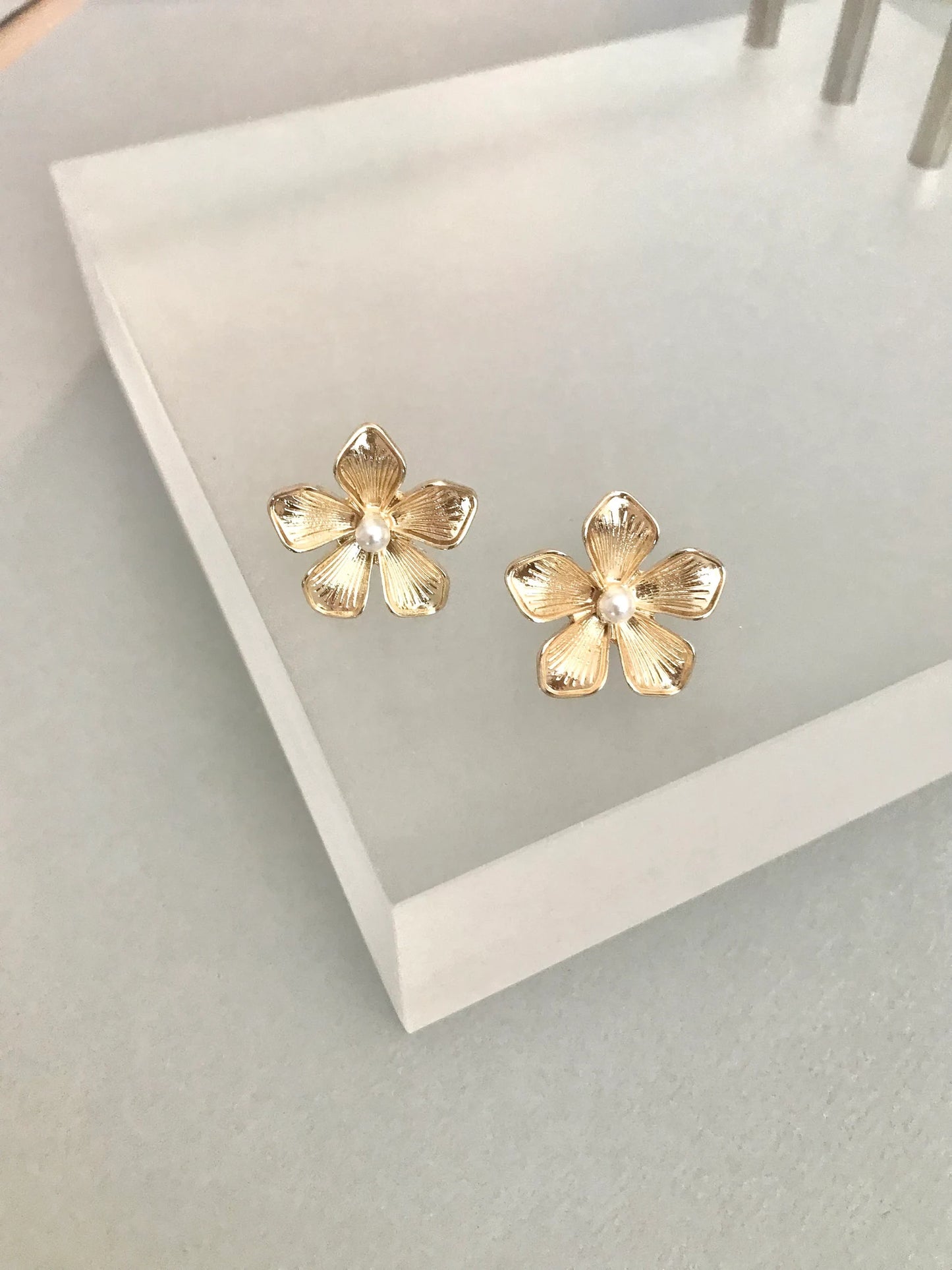 Gold flower stud earrings