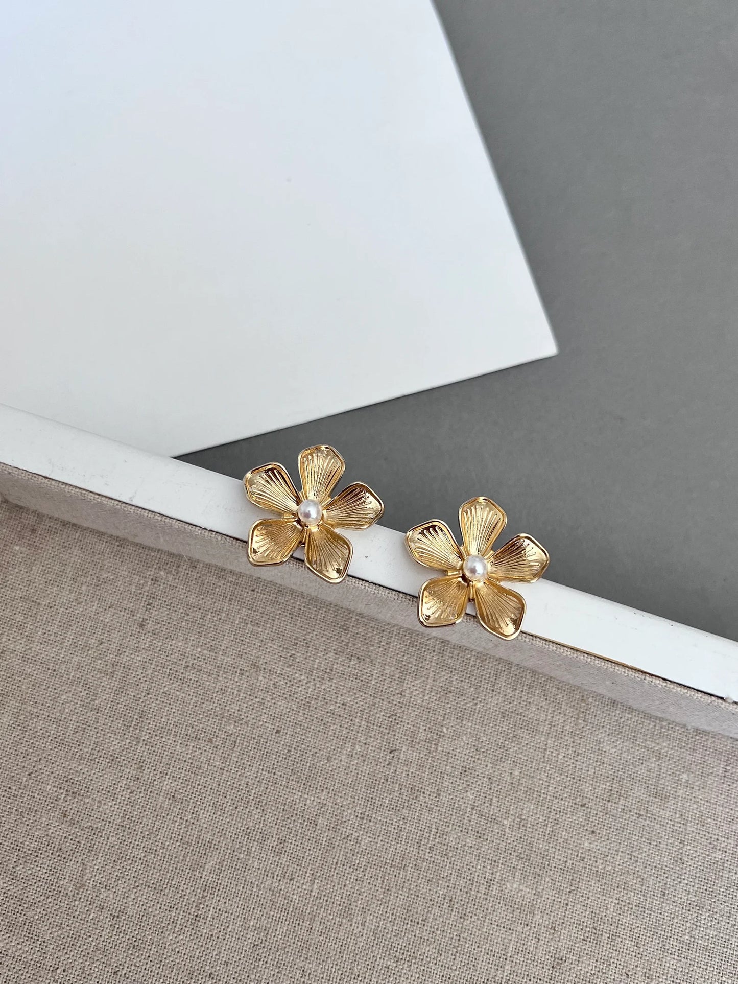 Gold flower stud earrings