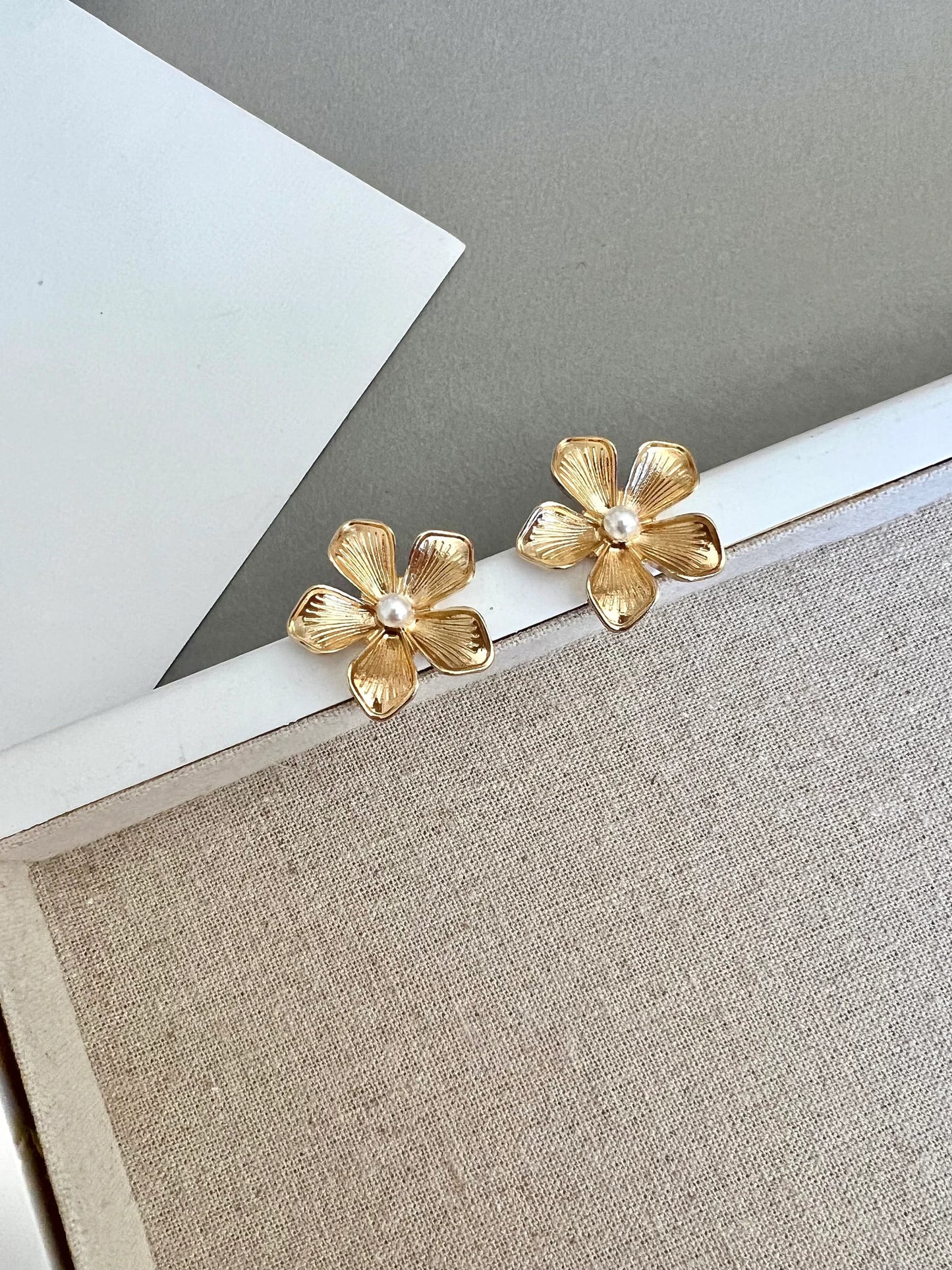 Gold flower stud earrings