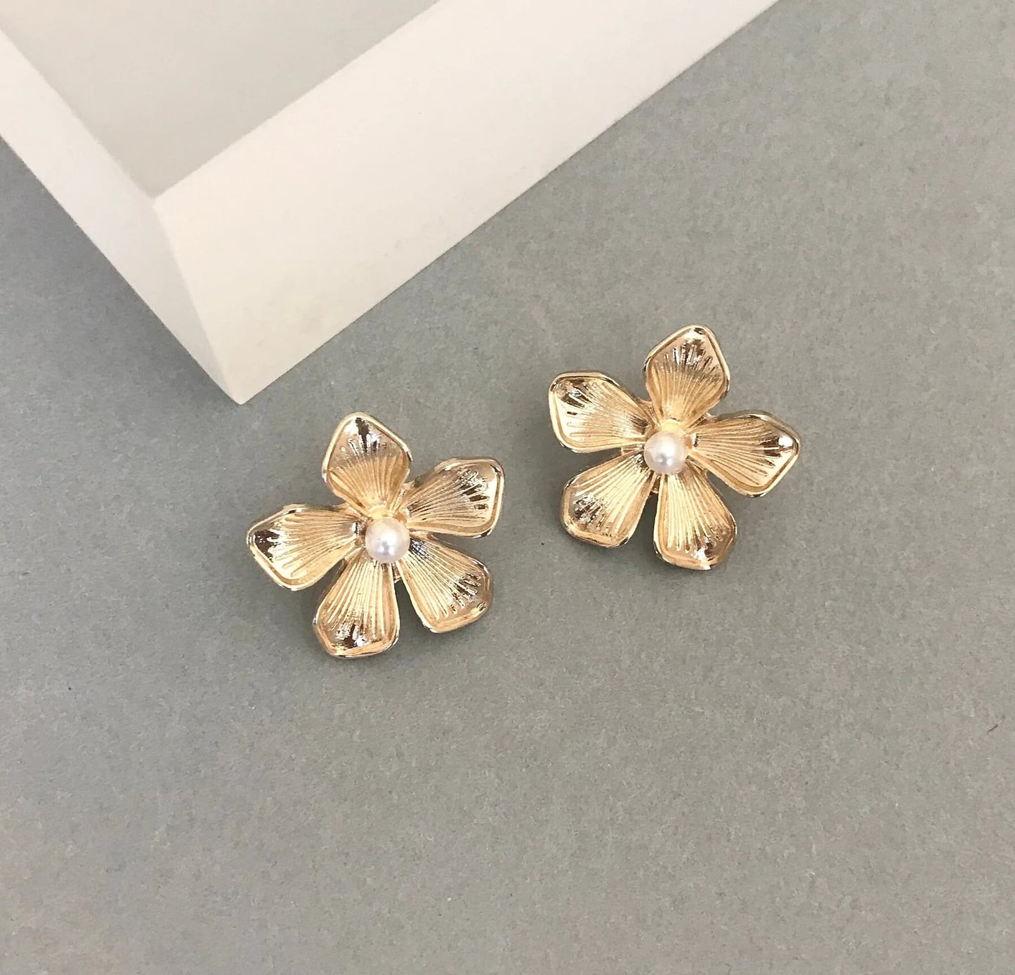 Gold flower stud earrings