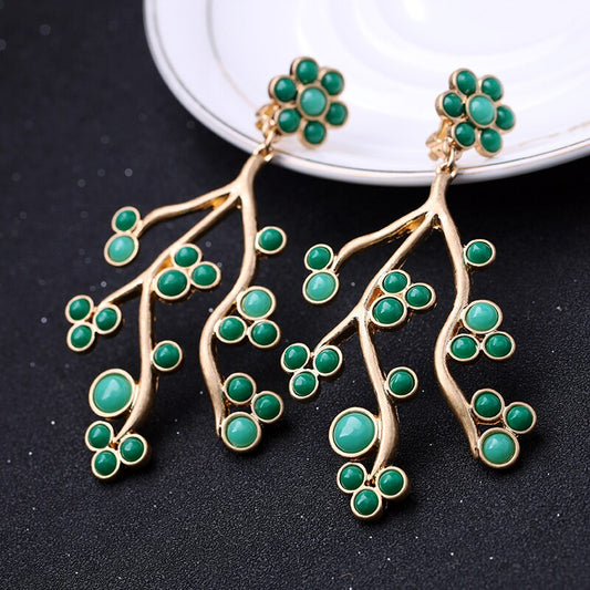 Green flower branch earrings