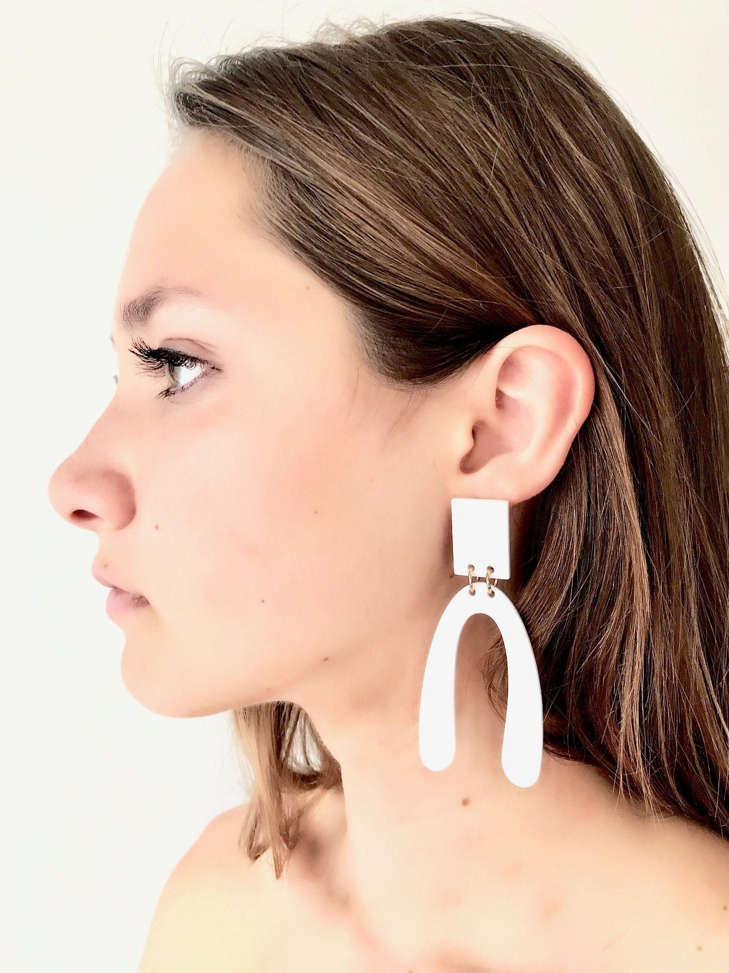 White arch earrings