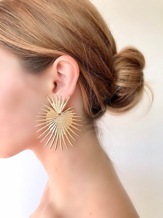 Gold star statement earrings