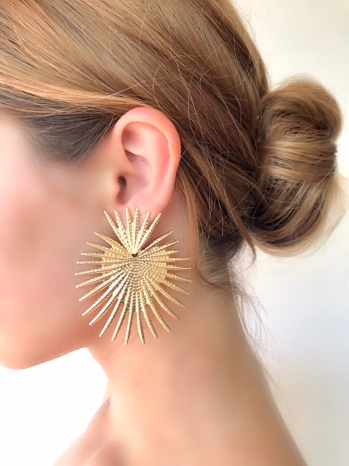 Gold star statement earrings