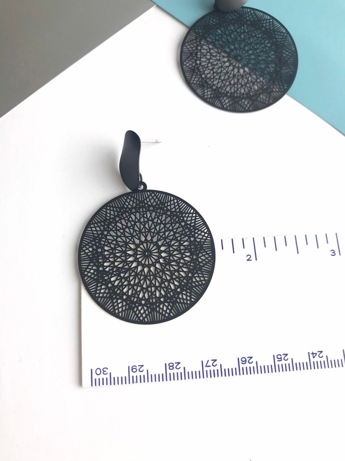 Black filigree disk earrings