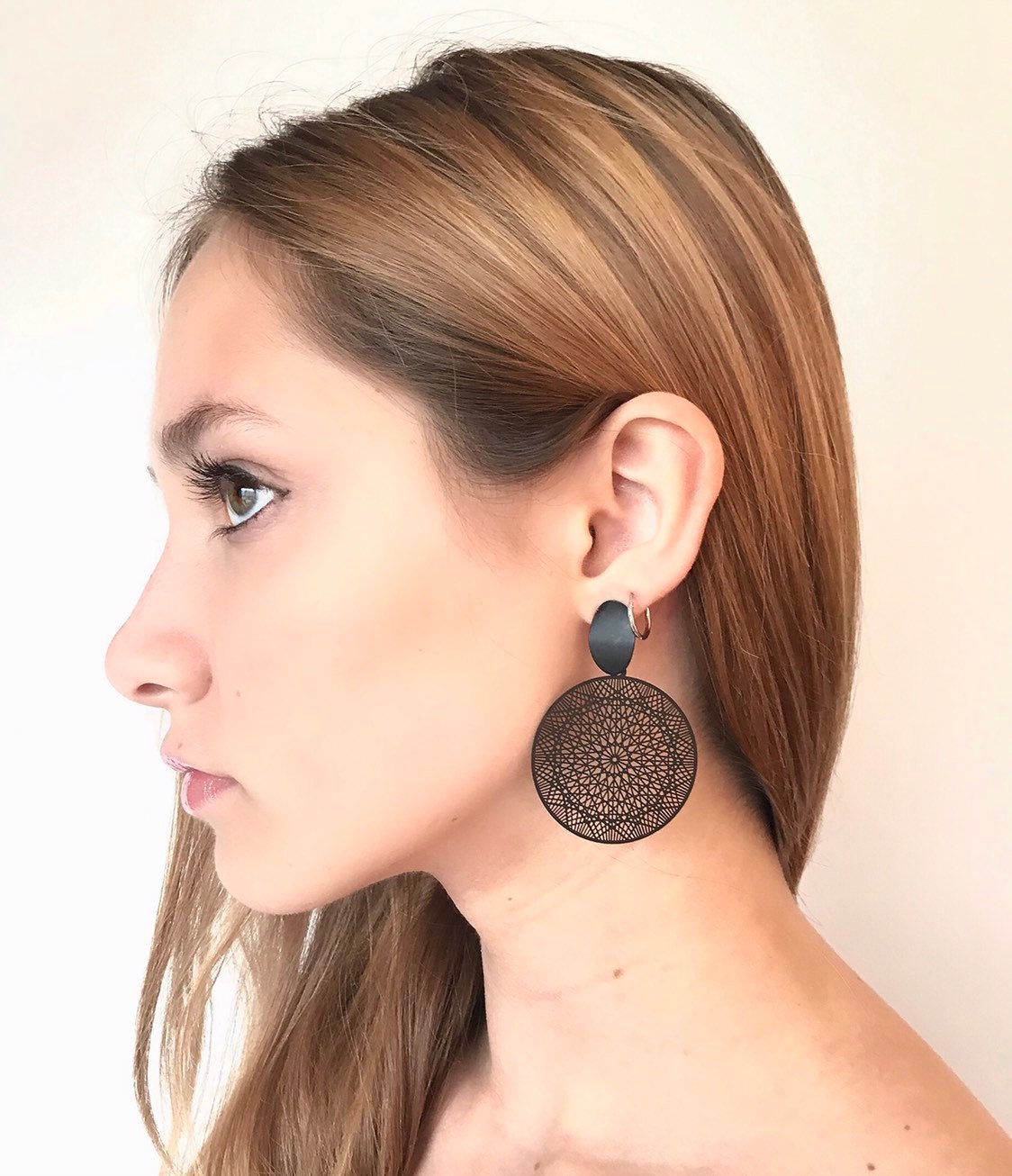 Black filigree disk earrings