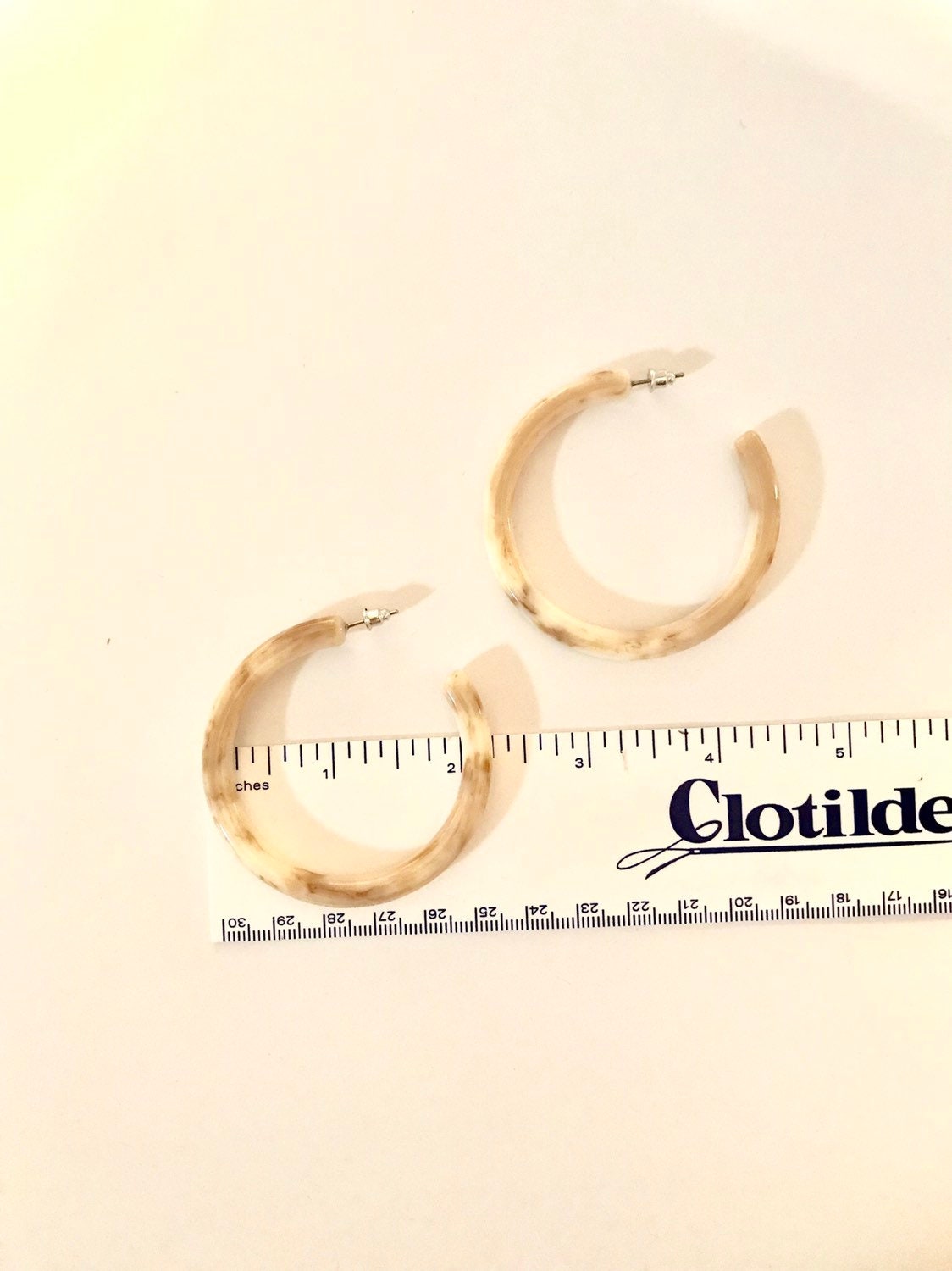 Large beige hoop earrings