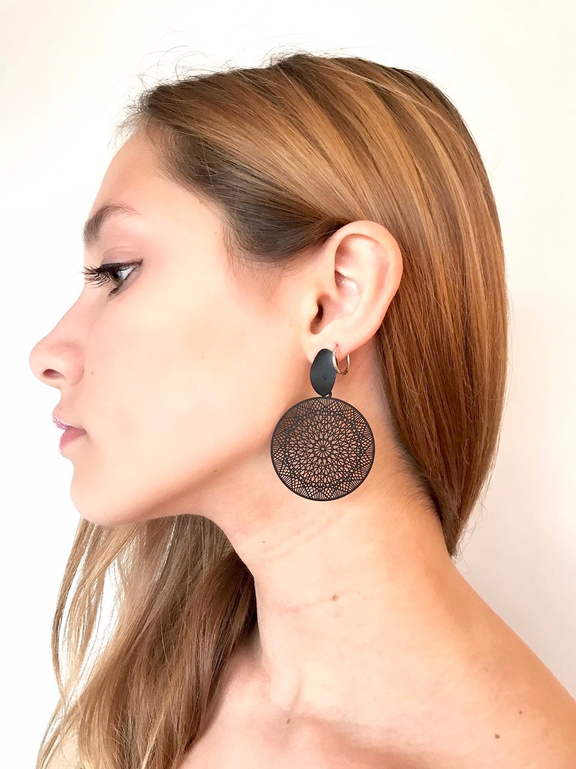 Black filigree disk earrings