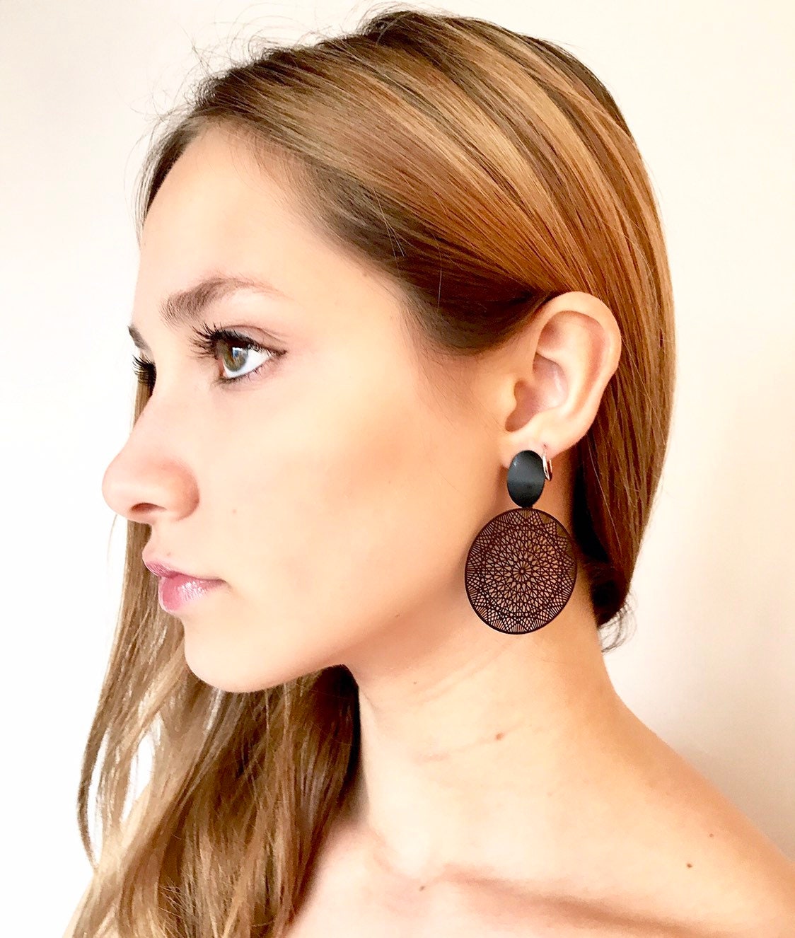 Black filigree disk earrings