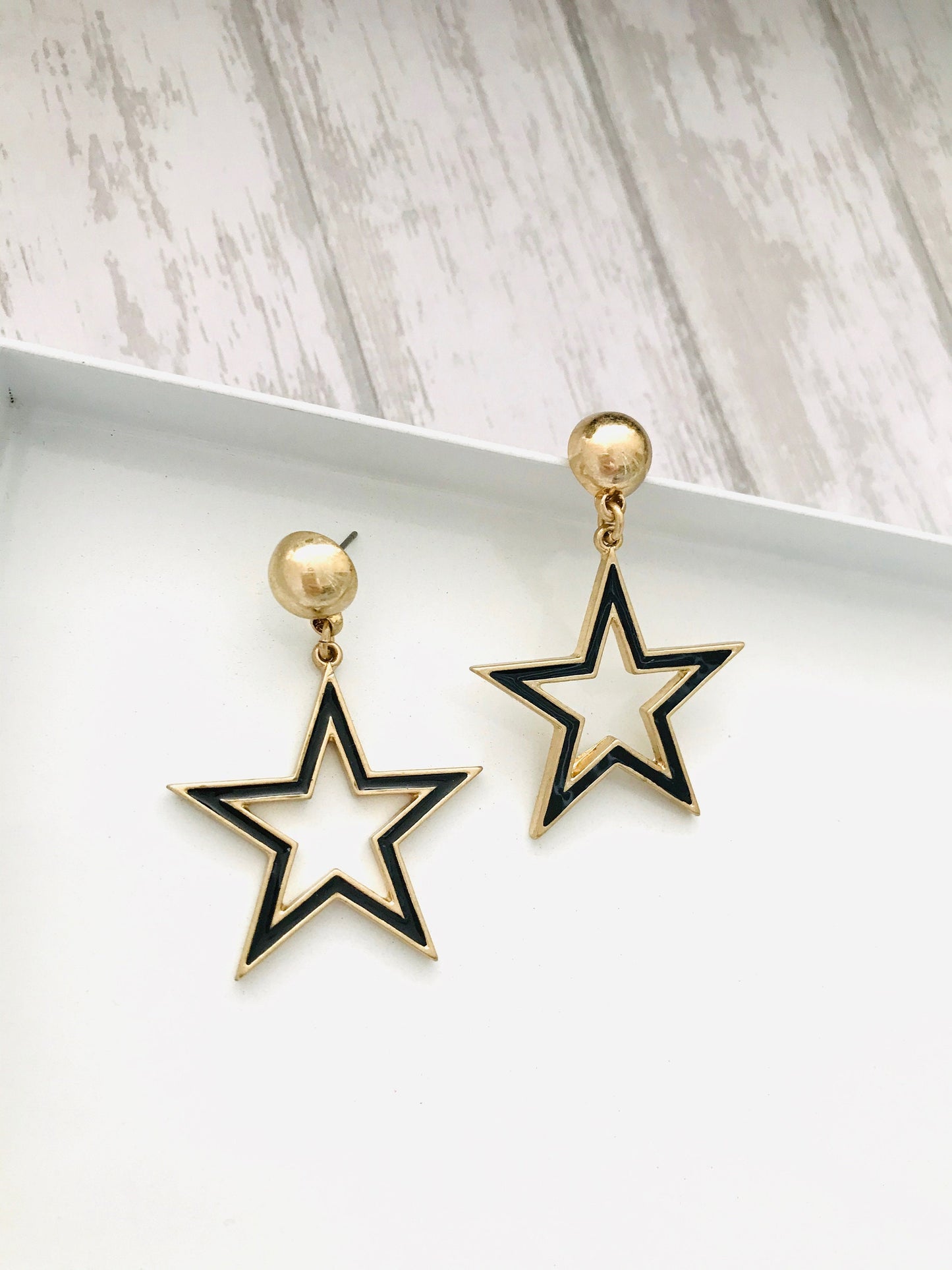 Black star earrings
