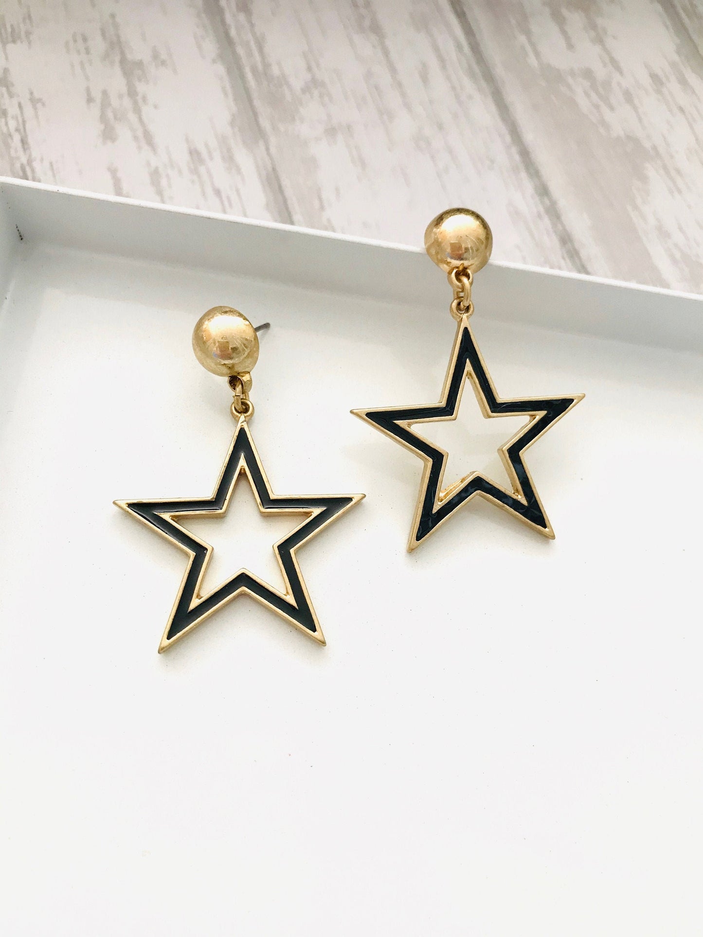 Black star earrings