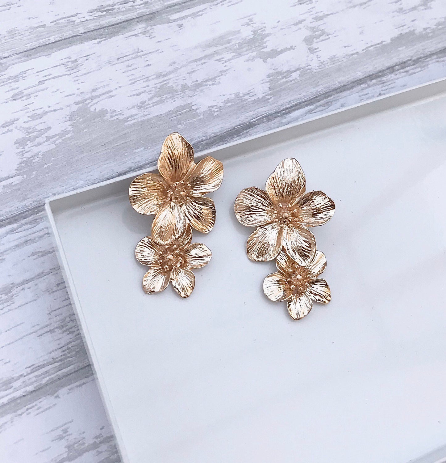 Gold flower drop earrings