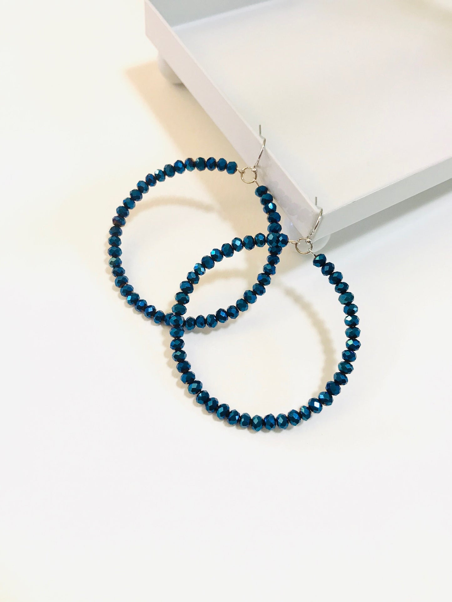 Midnight blue crystal hoop earrings