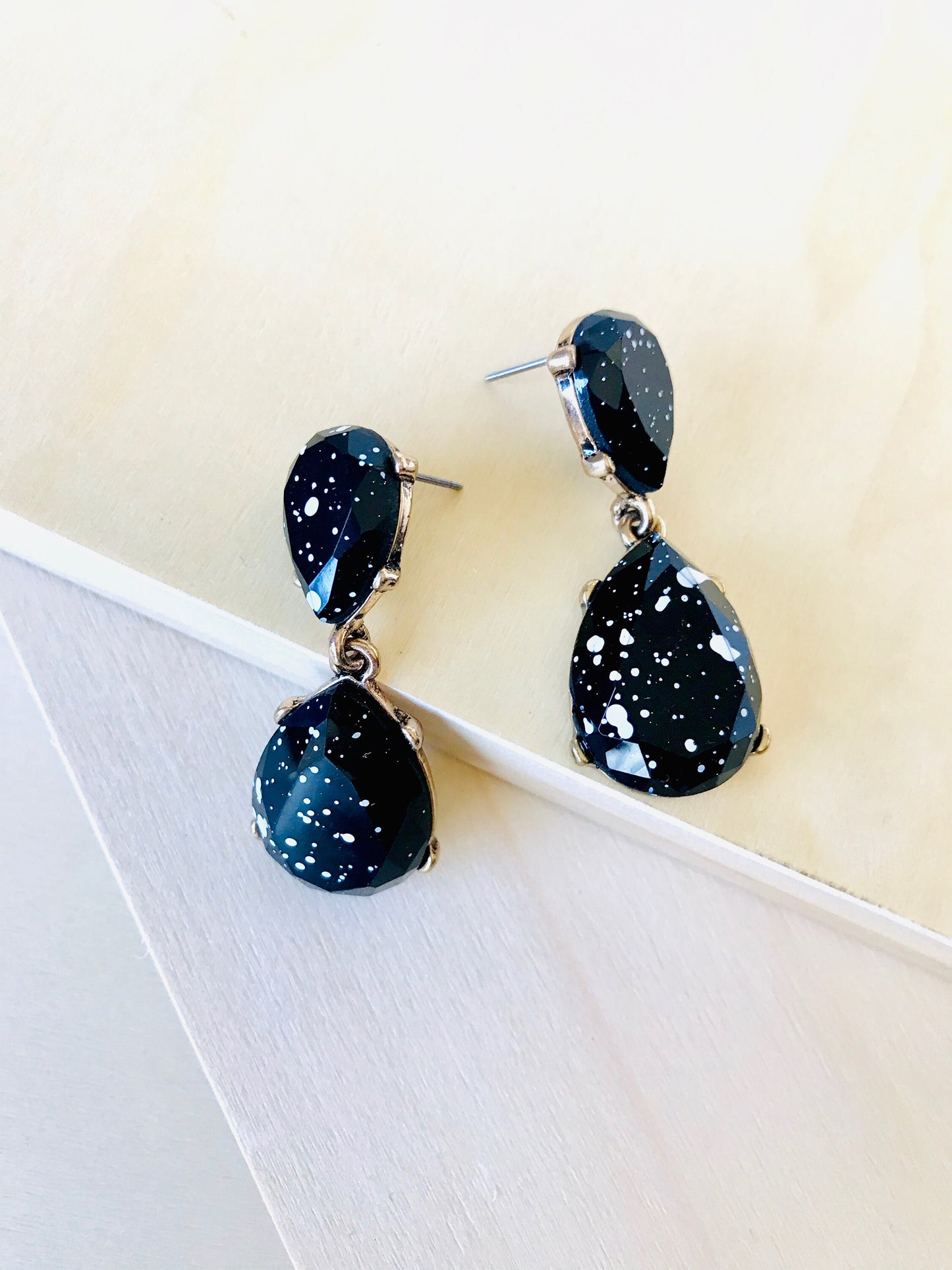 White splash black drop earrings