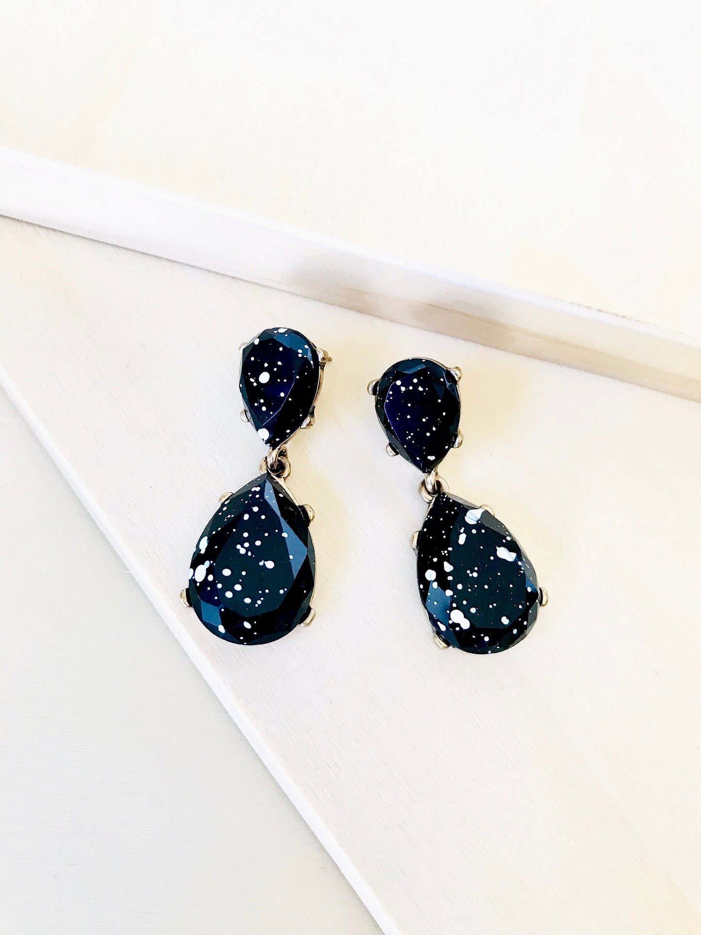 White splash black drop earrings