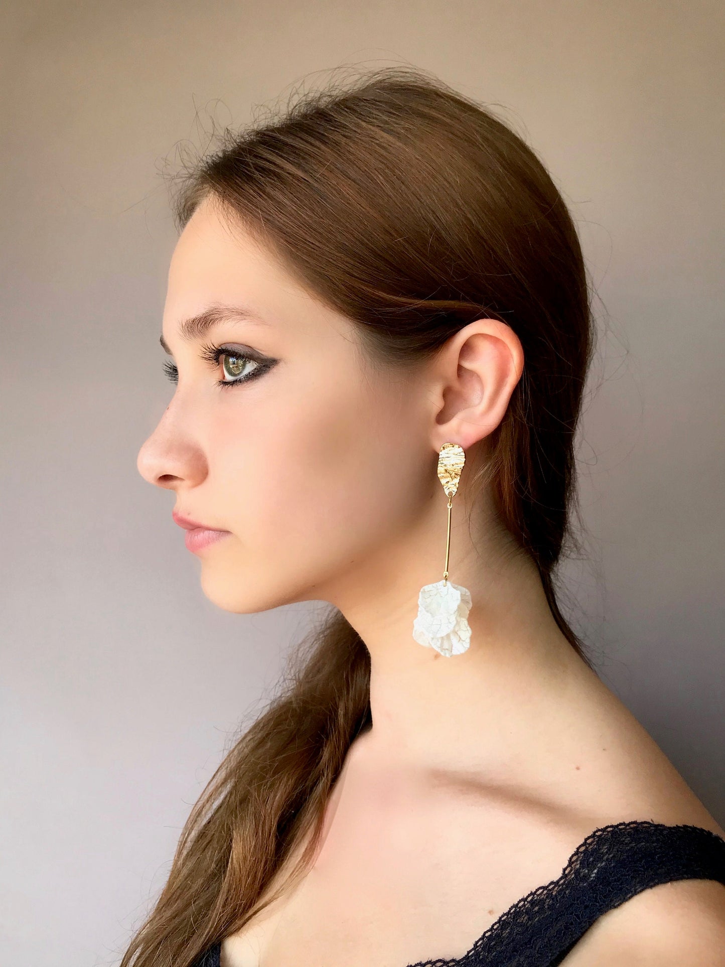 Long drop white petal earrings