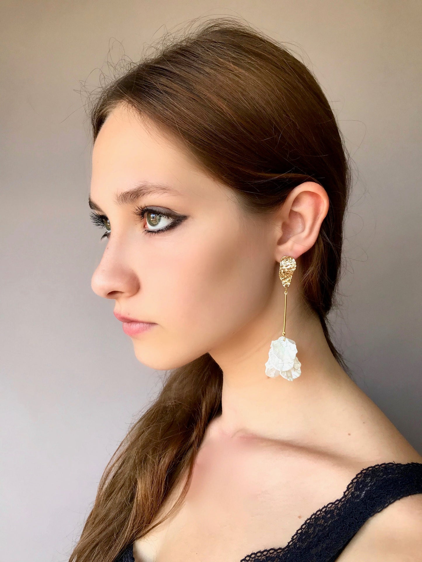 Long drop white petal earrings