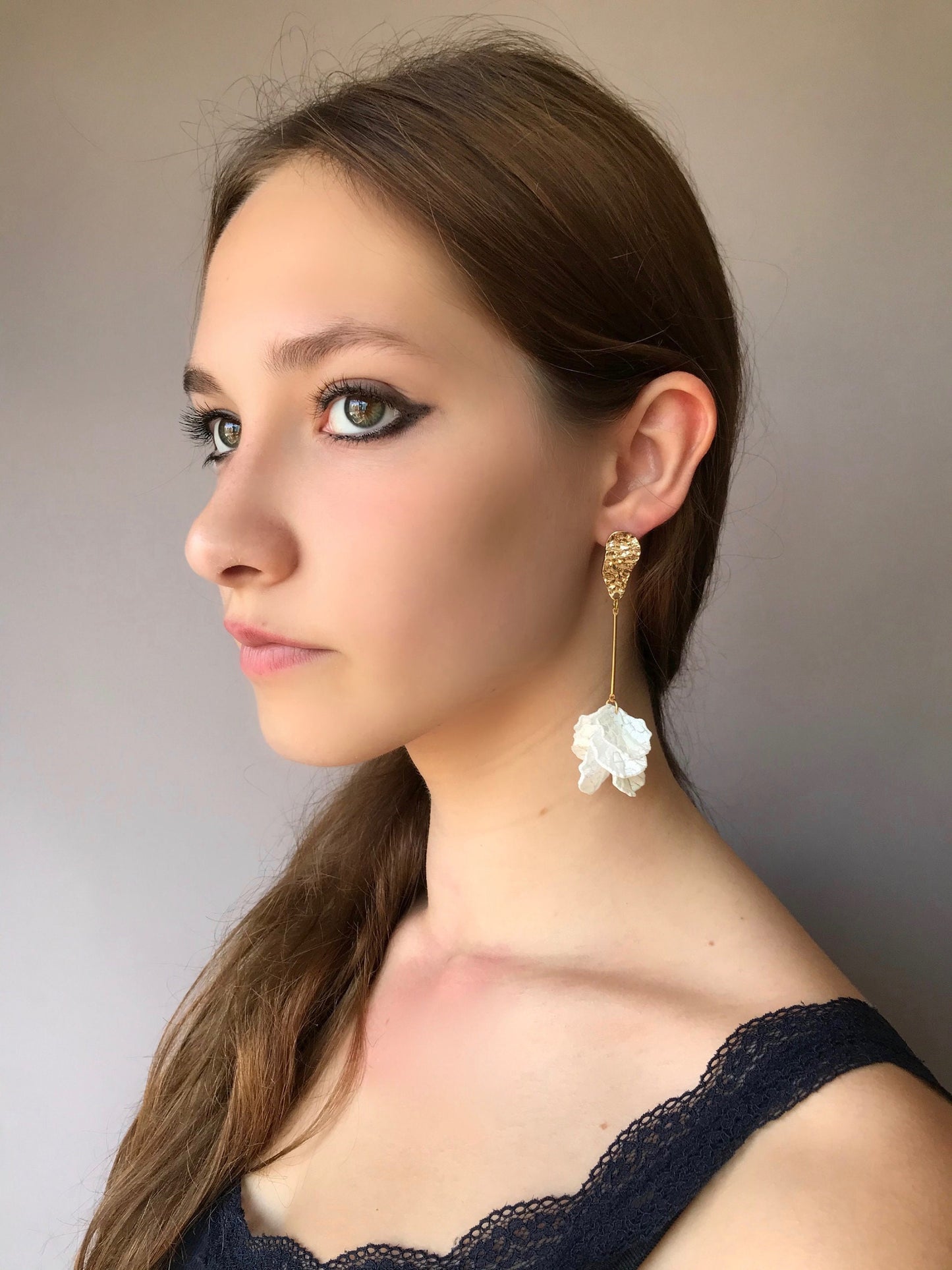 Long drop white petal earrings
