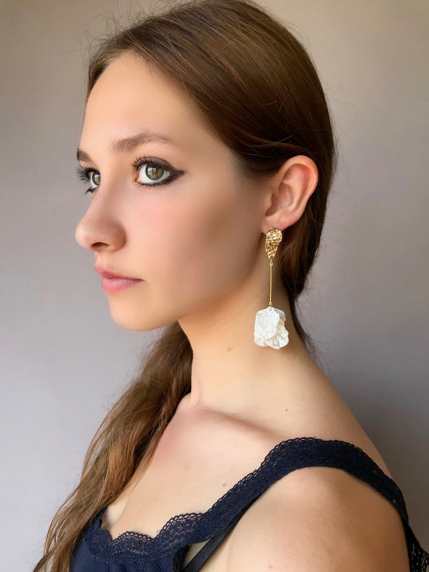Long drop white petal earrings