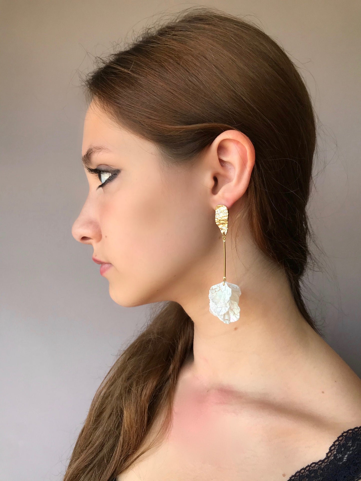 Long drop white petal earrings