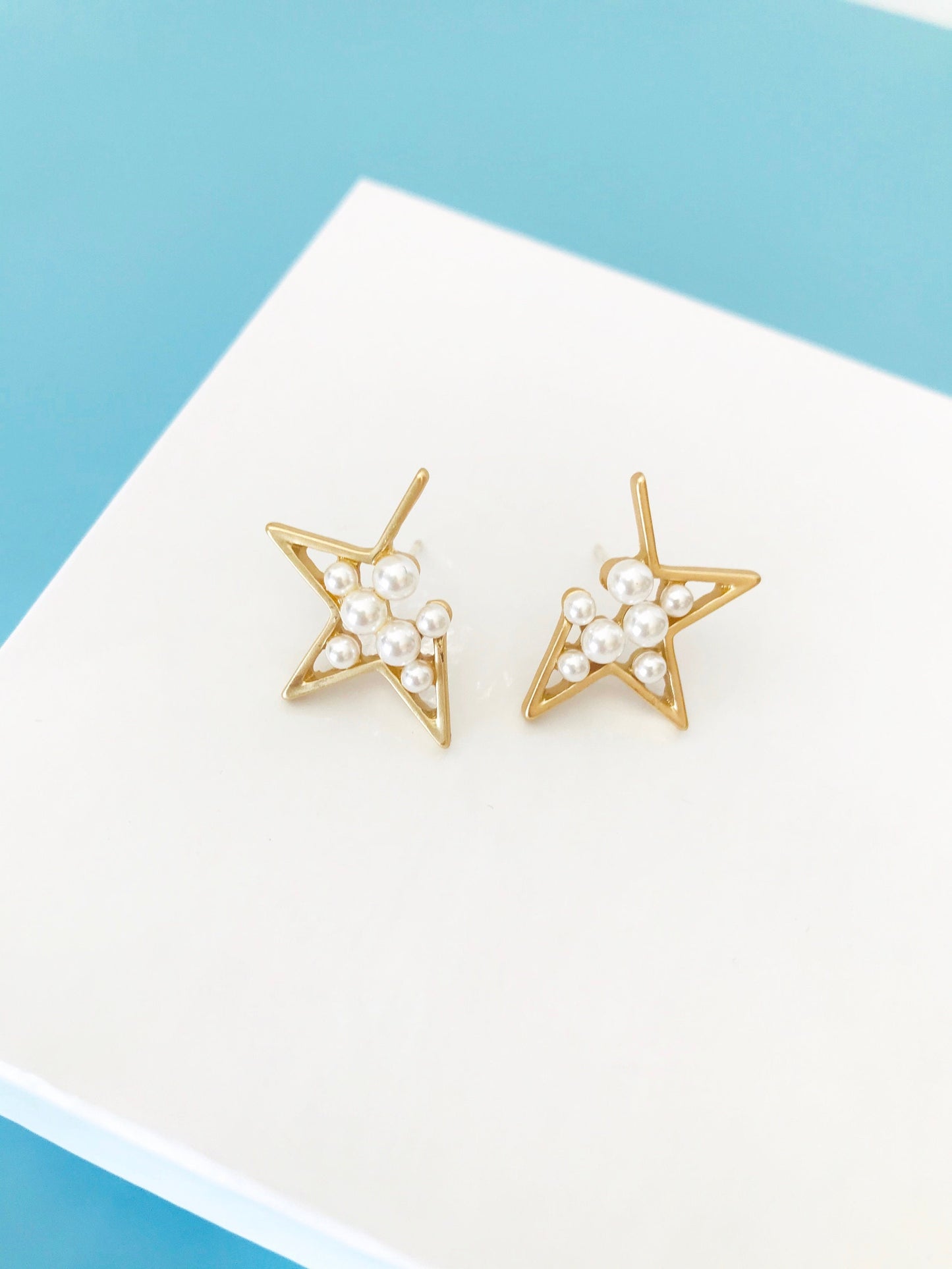 Pearl star earrings