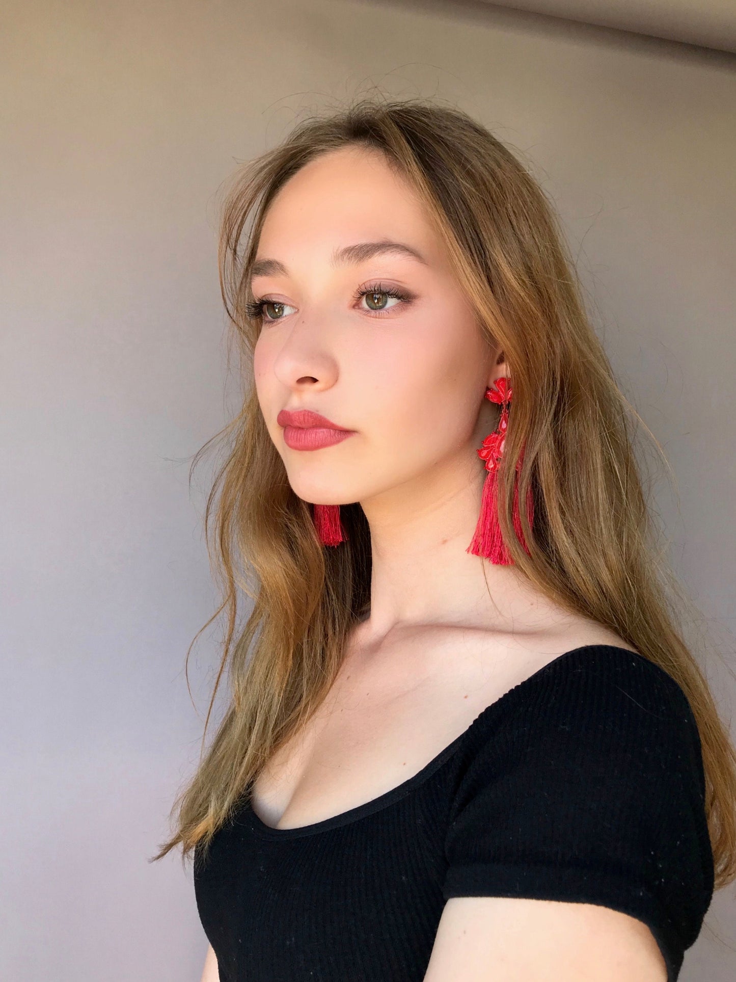 Red tassels statement earrings