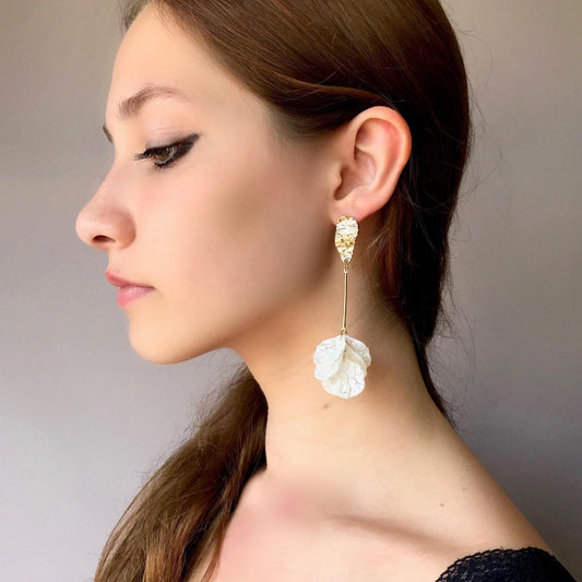 Long drop white petal earrings