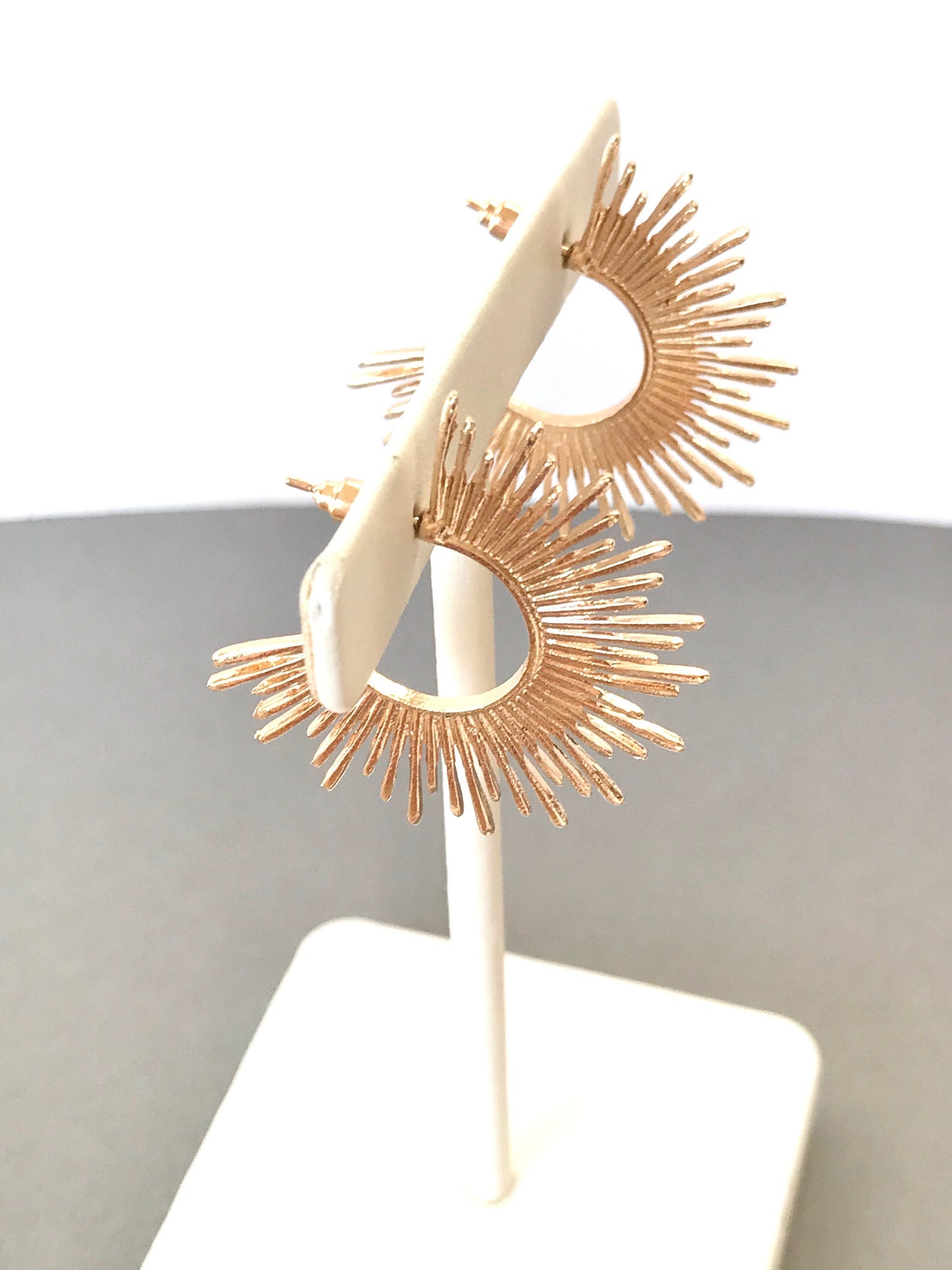 Gold starburst hoop earrings