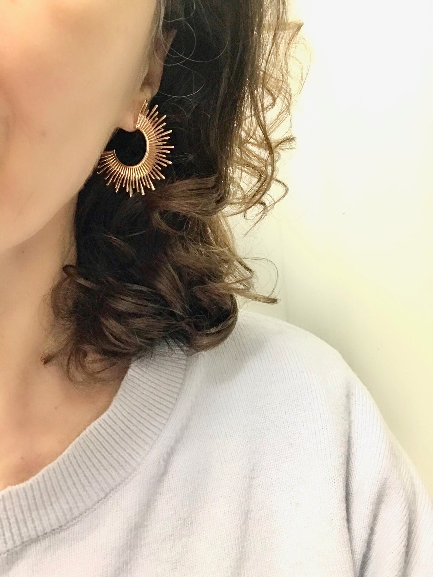 Gold starburst hoop earrings