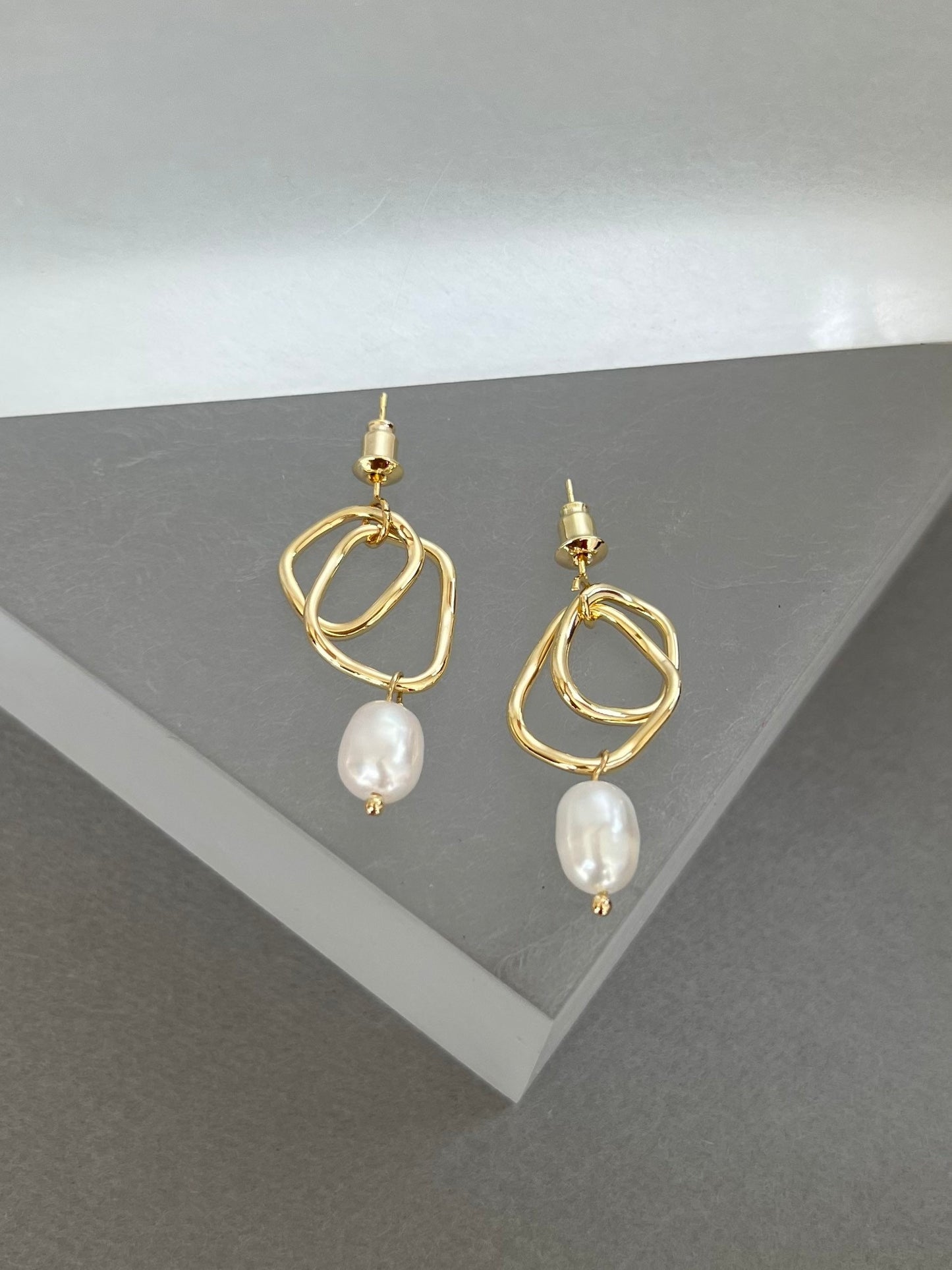 Gold design pearl earrings