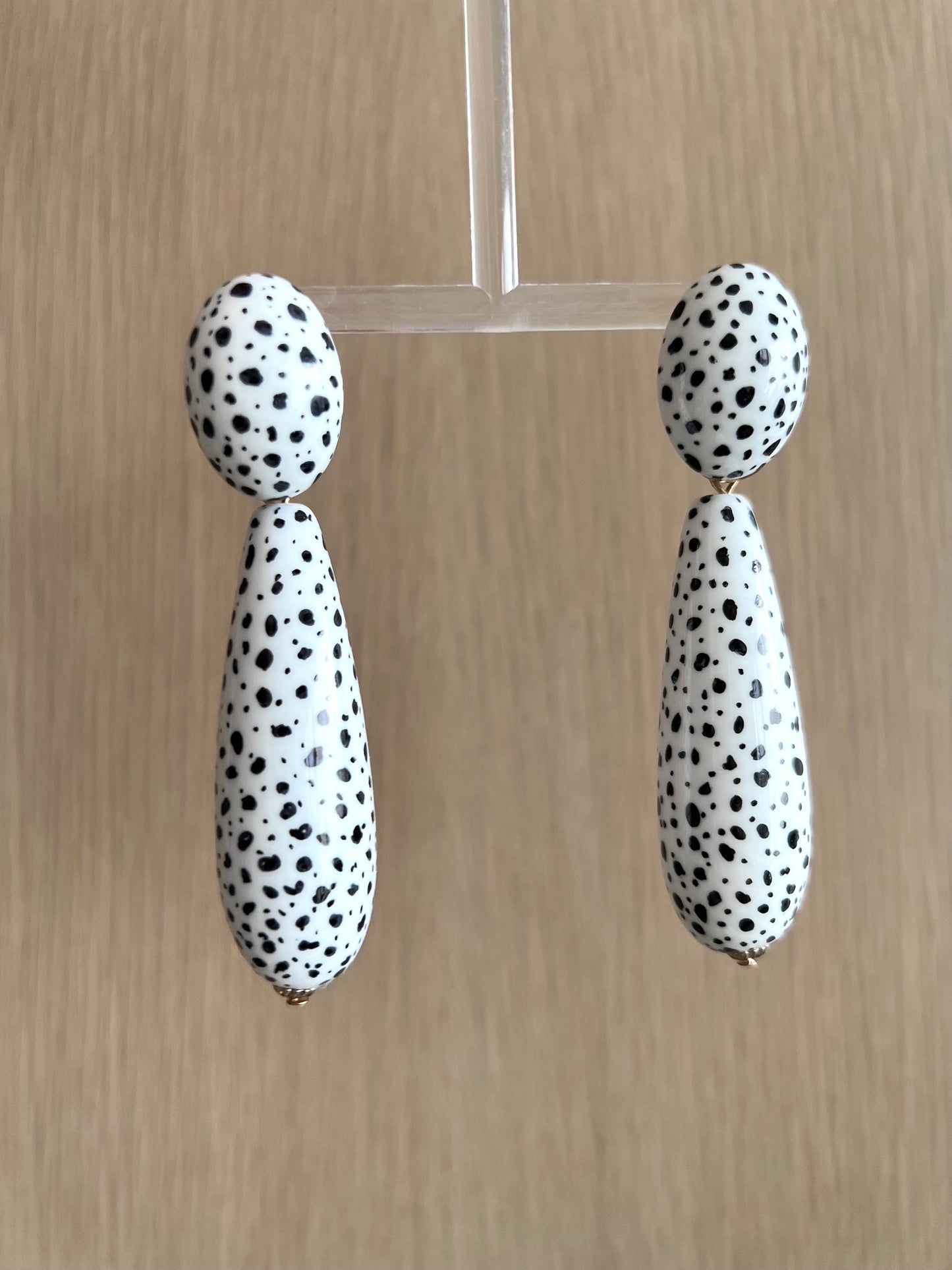 Large black spots teardrop white earrings