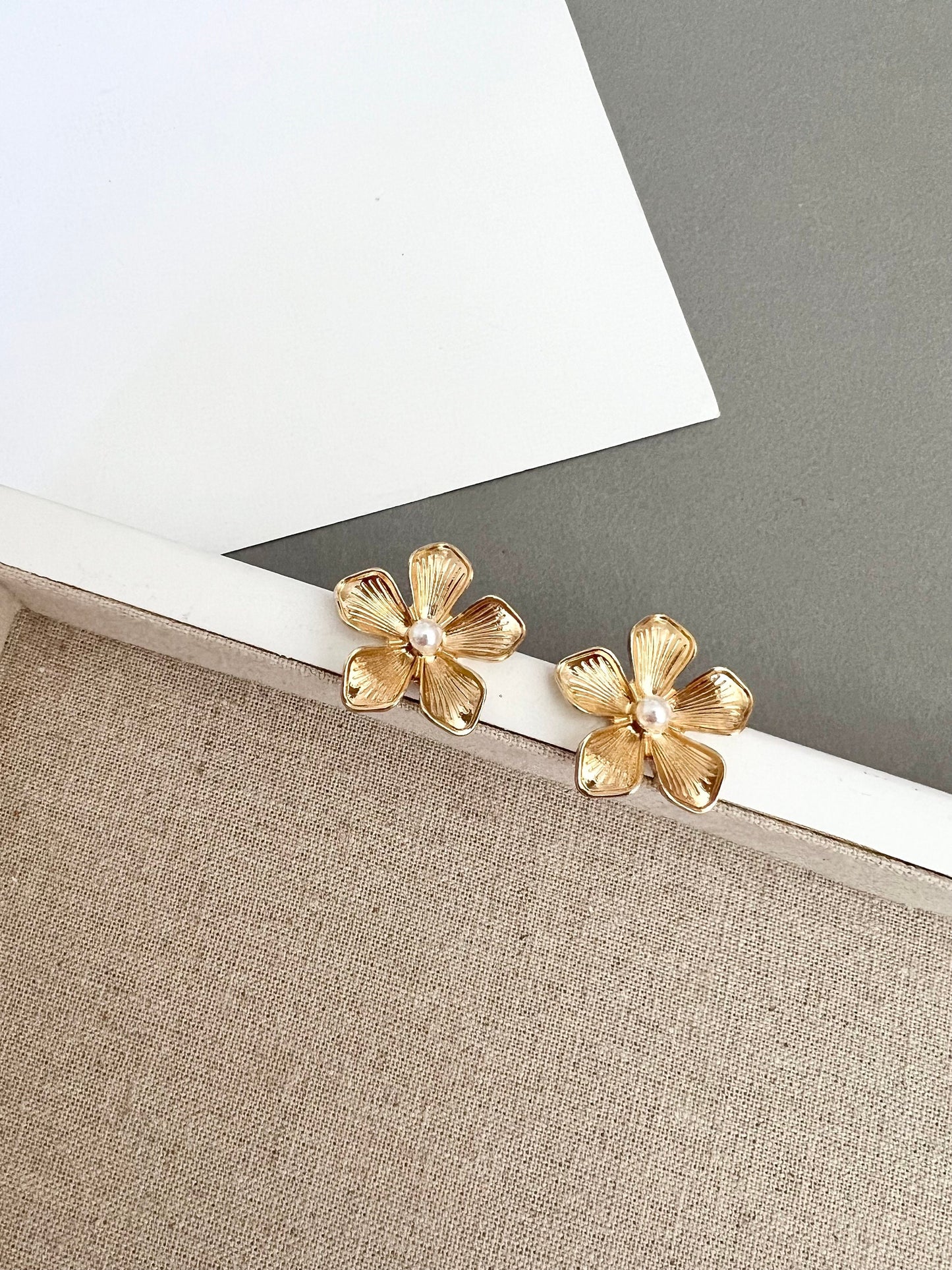 Gold flower stud earrings