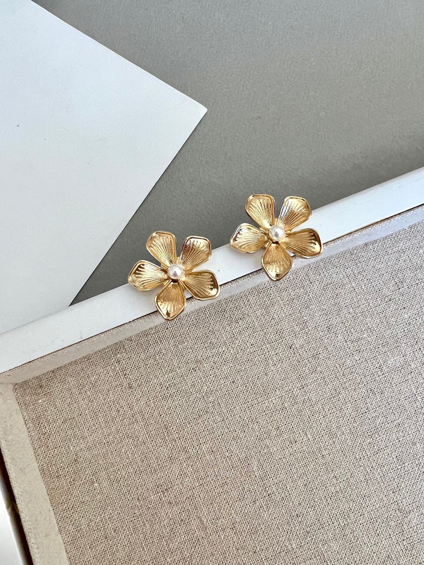 Gold flower stud earrings