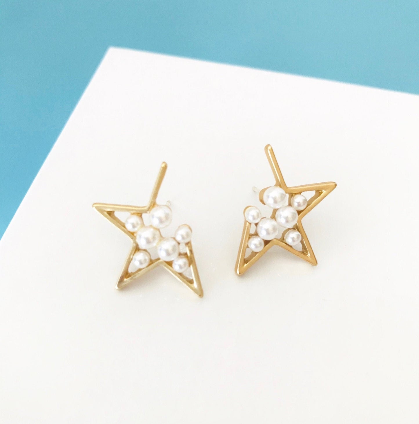 Pearl star earrings