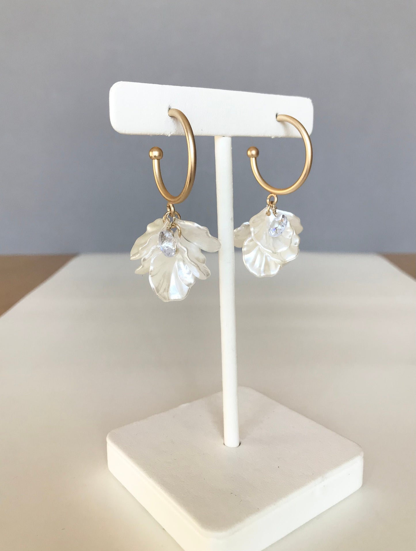 White petal hoop earrings