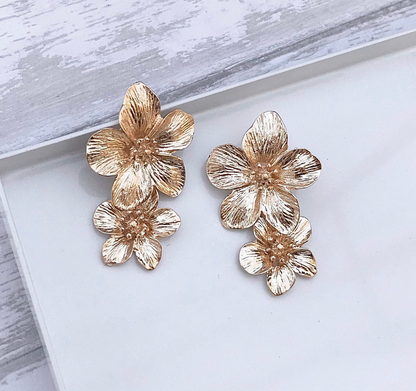 Gold flower drop earrings